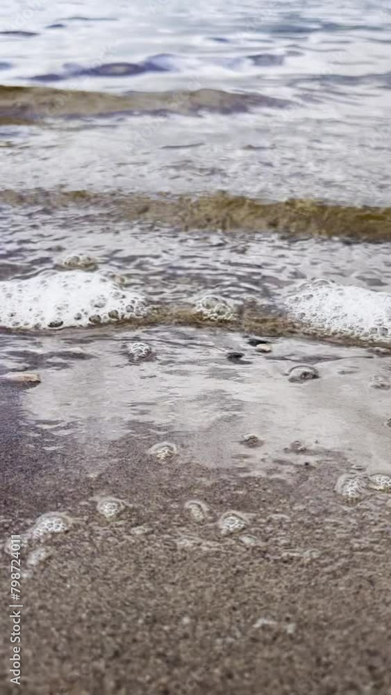 Waves and river sand close-up, slow motion video Waves and river sand close-up, slow motion video
