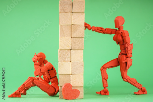 Сoncept photo two human figures symbolize the impossibility of communication. A wall between people
