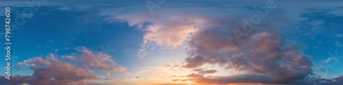 Dramatic Sunset sky 360 panorama. Vibrant sky panorama with bright glowing red pink Cumulus clouds. HDR 360 seamless spherical panorama. Sky dome for aerial drone panoramas. Climate and weather change