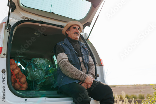 Bountiful Break Old Farmer and His Potato Harvest Stashed in Car Trunk photo