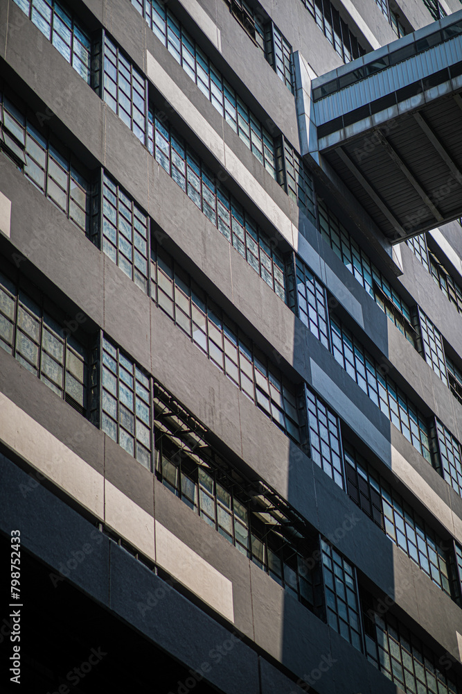 Close-up view of a contemporary building with white-framed windows Close-up view of a contemporary building with white-framed windows