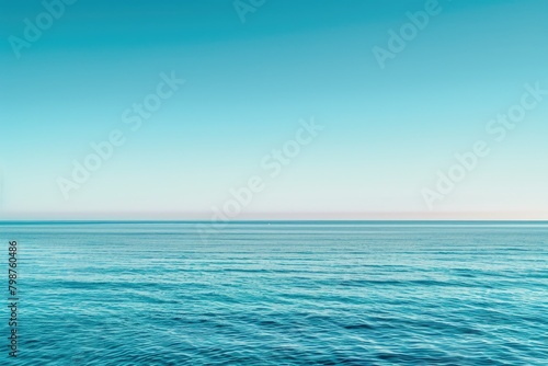 Vast lake with rippling waves under a clear blue sky