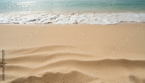 Seaside Solitude: Empty Sand Beach with Waves Background