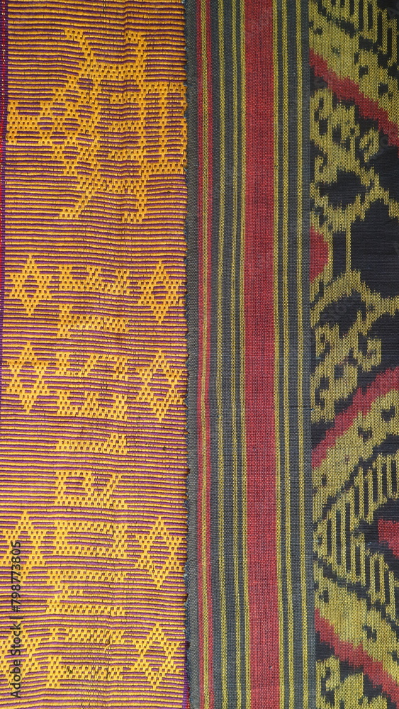 Handmade woven textile from Indonesia, textured ethnic fabric background Handmade woven textile from Indonesia, textured ethnic fabric background