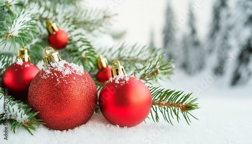 christmas and new year holidays concept. Red balls on fir branches, winter snowy backdrop. festive winter season background. template for design. banner, copy space