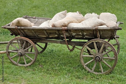 Old wood cart loaded with sacks