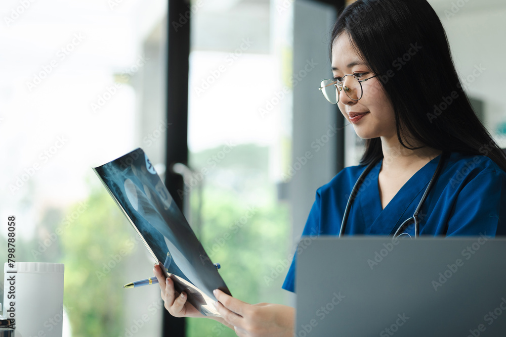 Medical  working on digital tablet healthcare doctor technology tablet using x-ray film analyzed the results of medical reports.