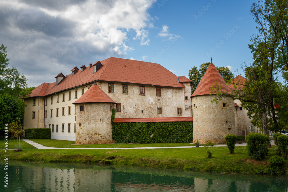 Grad Otočec landscape image of a castle near the river