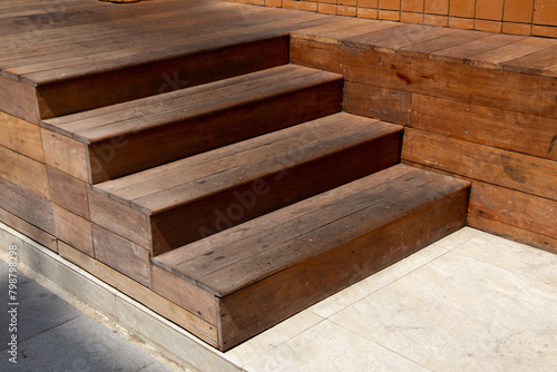 Brown wooden steps Stay outside in sunlight.