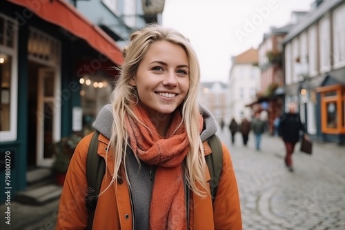 Portrait of a beautiful young woman walking in the old town. © Stocknterias