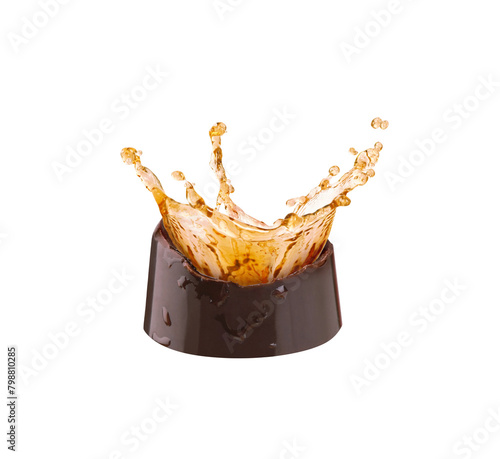 chocolate candy with a splash of brandy on a white background