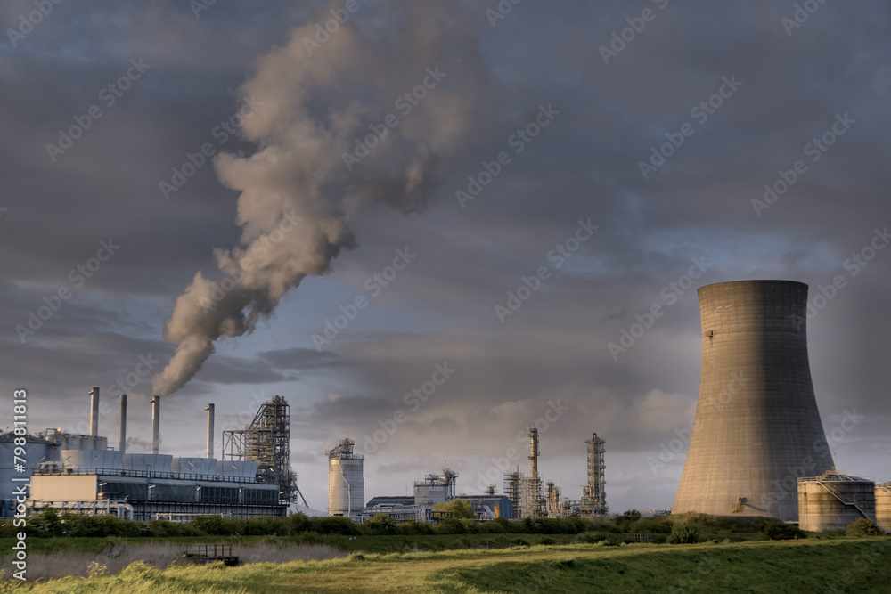 HDR Oil refinery, cooling towers, with smoke.