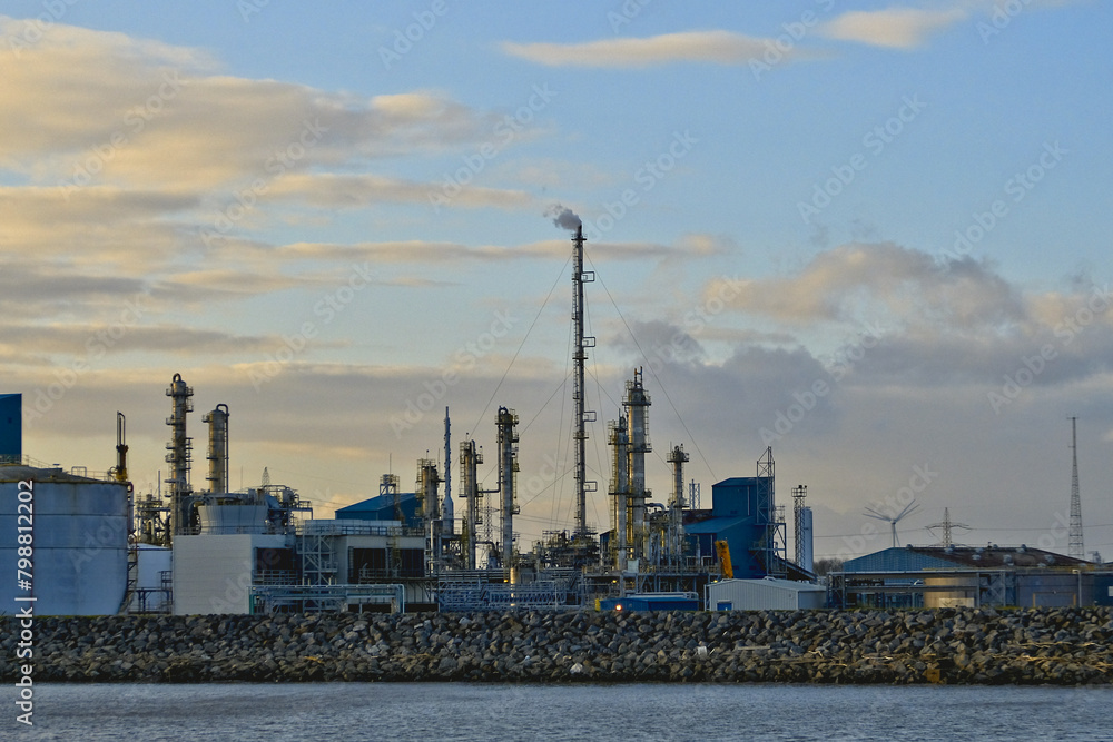 HDR Oil refinery, cooling towers, with smoke.