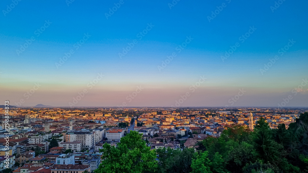 Aerial view of historic medieval walled city of Bergamo seen from Città Alta (Upper Town), Lombardy, Northern Italy, Europe. Landscape at the city center, Its historical buildings and the towers