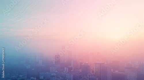 A city skyline with a pink and blue sky. The sky is hazy and the sun is setting