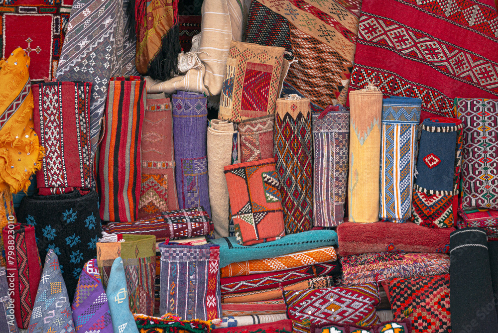 Moroccan carpets and rugs, handwoven by the berber tribes on display. Variety of carpets styles, patterns and colors.