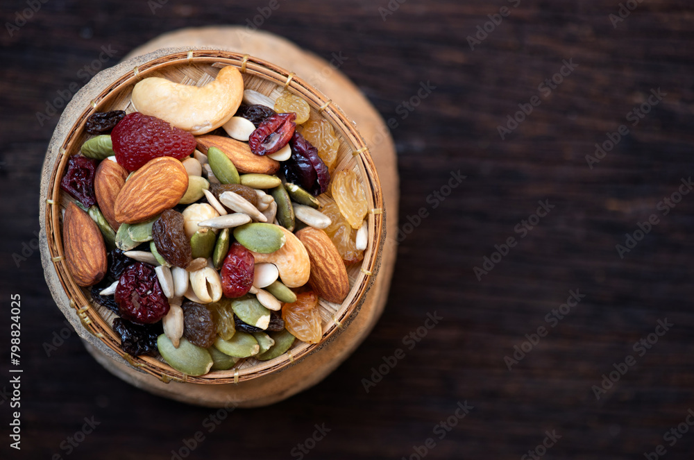 Grains such as almond seeds, pumpkin seeds on an old wooden background.top view Grains such as almond seeds, pumpkin seeds on an old wooden background.top view