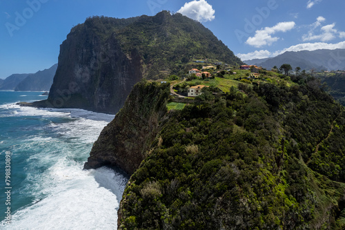Madeira coast, green lush hills and Atlantic Ocean. Aerial drone view © marcin jucha