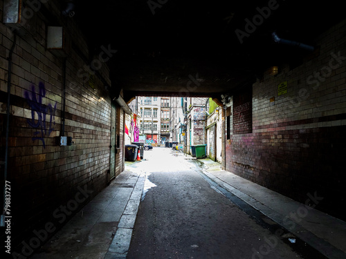 A tunnel leading to a courtyard