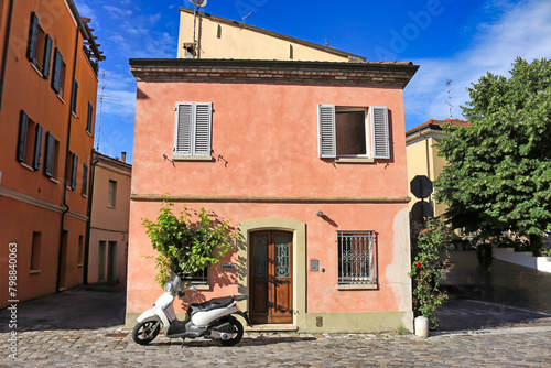Old colorful houses and scooter in Rimini Italy