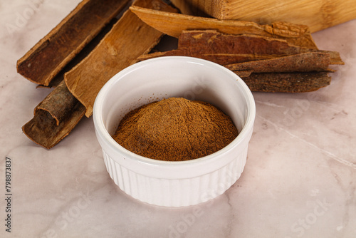 Natural Cinnamon powder with sticks © Andrei Starostin
