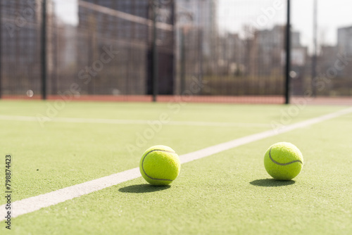 Bright greenish, yellow tennis ball on freshly painted court © Angelov