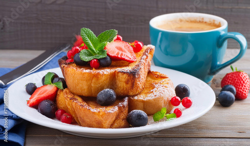 french toast with berries and a coffee