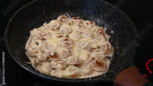 fried boiled dumplings cooked uncooked in a pan frying