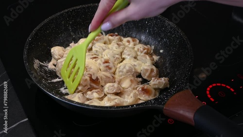 fried boiled dumplings cooked uncooked in a pan frying