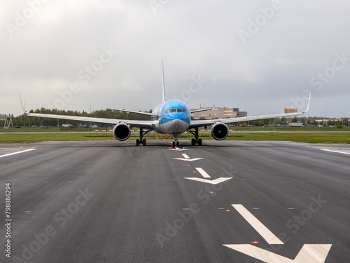 airplaine on take off runway airstrip in Schipol Airport photo