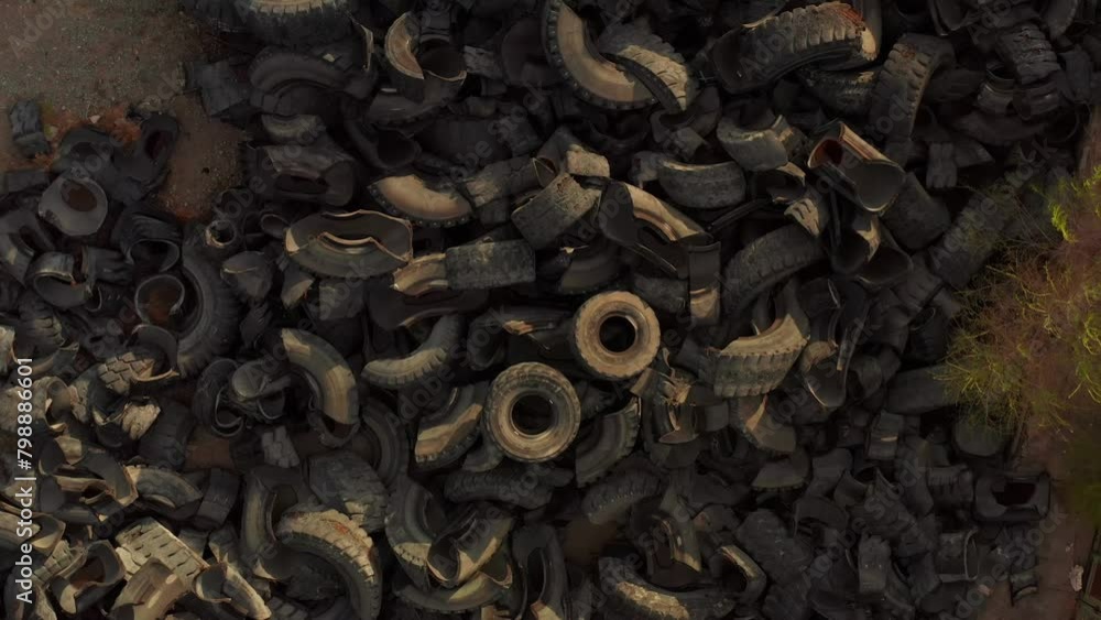 Drone view, old tires being industrial garbage, industrial landfill for processing. Close-up. Environment disaster concept. Environmental pollution. Drone view, old tires being industrial garbage, industrial landfill for processing. Close-up. Environment disaster concept. Environmental pollution.