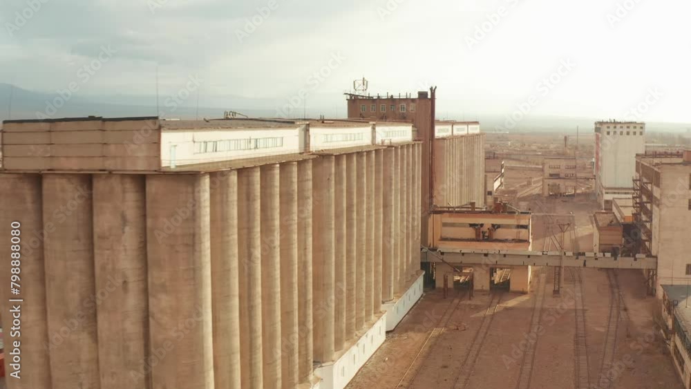 Aerial view grain mill factory, agro-processing and manufacturing plant for storage of agricultural products, flour, cereals and grain. Flour production. Aerial view grain mill factory, agro-processing and manufacturing plant for storage of agricultural products, flour, cereals and grain. Flour production.