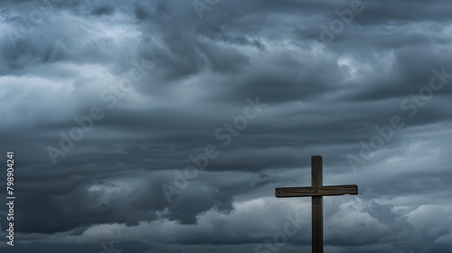A wooden Christian cross seen from a field