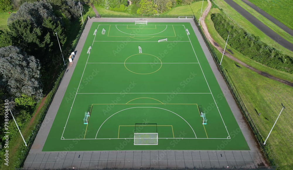 Paignton, Torbay, South Devon, England: DRONE VIEW: Overhead view of an all-weather sports pitch used for football, five-a-side soccer and field hockey. It is part of Clennon Valley playing fields.