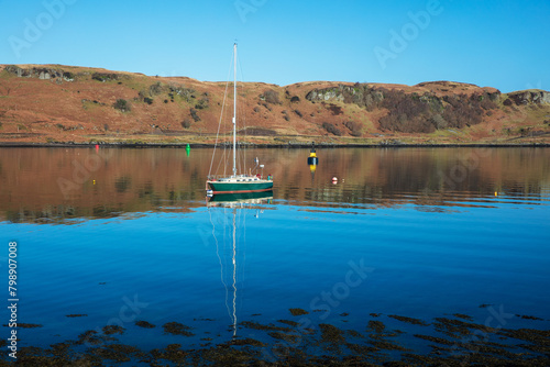 Small boat in calm water, Sound of Kerrera, Oban, Argyll and Bute, Scotland, UK.