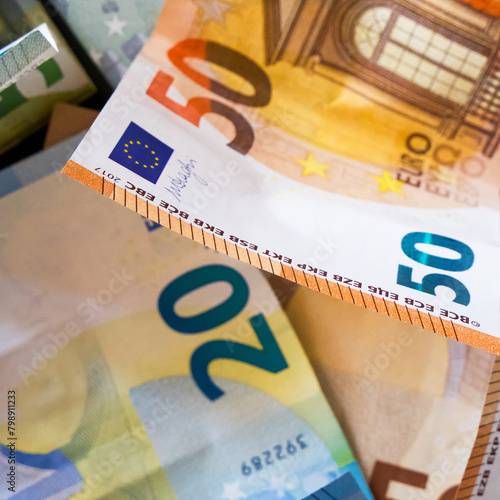 Euro Currency Focus. A close-up of €20 and €50 notes, highlighting the currency’s design and colors.
