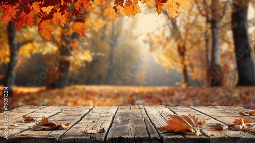 An autumn backdrop frames an unoccupied wooden table photo