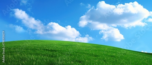 Ultrawide Background Photo Of Green Grass Hill And Blue Sky With Clouds