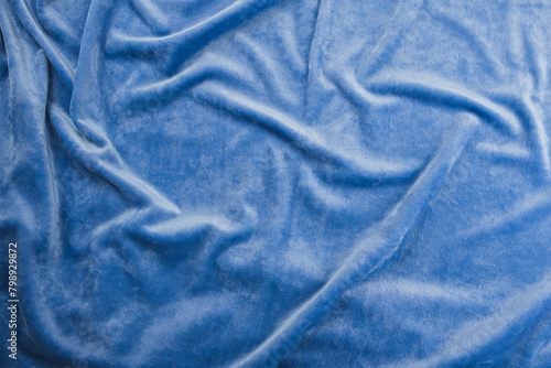 Texture of light blue velour fabric, top view. A noble sky shade with rich drape and a smooth texture with a beautiful matte sheen. background texture, pattern.