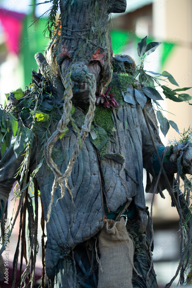Fototapeta premium Man dressed as a fantasy tree at a medieval fair