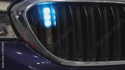 Flashing Blue Light in Grille at Police Interceptor Vehicle Front photo