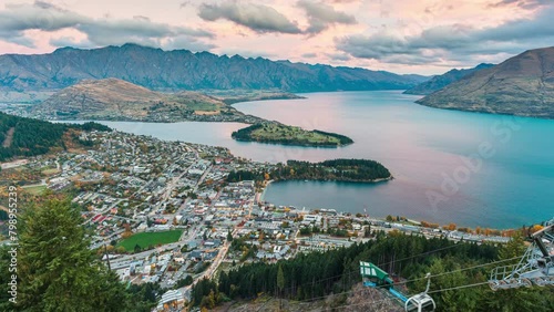 Viewpoint of Queenstown city with lake wakatipu and gondola station in the sunset at New Zealand photo