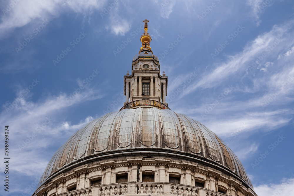 Detail of the leaded dome, the Golden Gallery, and the lantern with its golden ball and cross, St Paul's Cathedral, London.