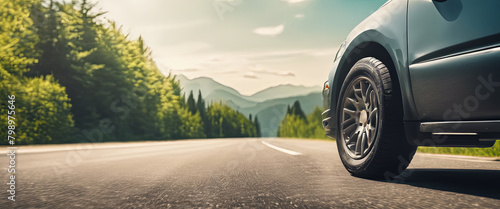 Summer tires on road in sunny day near beautiful. photo