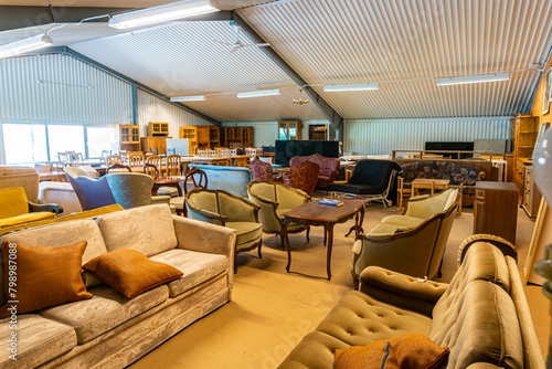 A big furniture store, second-hand. A lot of different furniture in the warehouse.