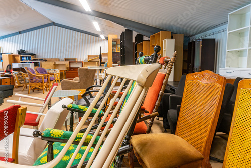 A big furniture store, second-hand. A lot of different furniture in the warehouse. © Bohdan