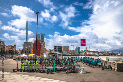Electric scooter and bicycle hub in Gothenburg harbor view photo