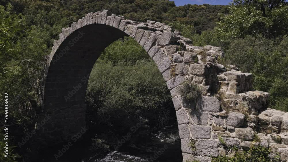 View of the remains of the medieval Roman bridge of Alcanzorla, on the Guadarrama river, Galapagar, Community of Madrid View of the remains of the medieval Roman bridge of Alcanzorla, on the Guadarrama river, Galapagar, Community of Madrid
