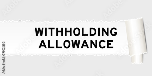 Ripped gray paper background that have word withholidng allowance under torn part