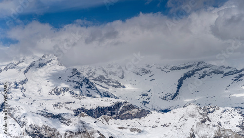 Monte Rosa snowy slopes engulfed by clouds in Sesia valley  Italy
